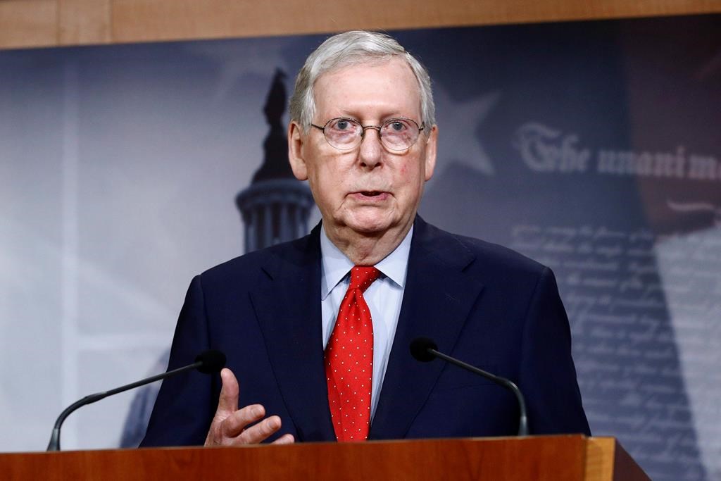 FILE - In this April 21, 2020, file photo Senate Majority Leader Mitch McConnell of Ky., speaks with reporters after the Senate approved a nearly $500 billion coronavirus aid bill on Capitol Hill in Washington. The Senate is set to resume Monday, May 4.