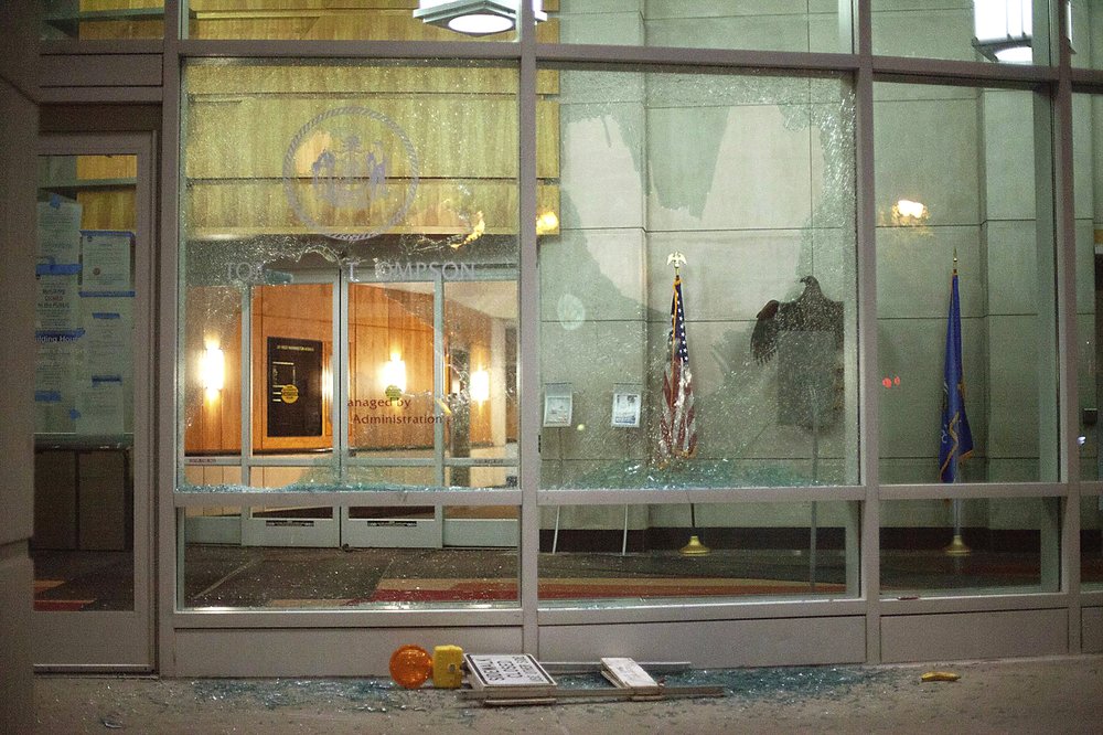 The windows of the Tommy G. Thompson Center on Public Leadership in Madison, Wis. are shattered during demonstrations Tuesday, June 23, 2020. Crowds outside the Wisconsin State Capitol tore down two statues and attacked a state senator amid protests following the arrest of a Black man who shouted at restaurant customers through a megaphone while carrying a baseball bat.