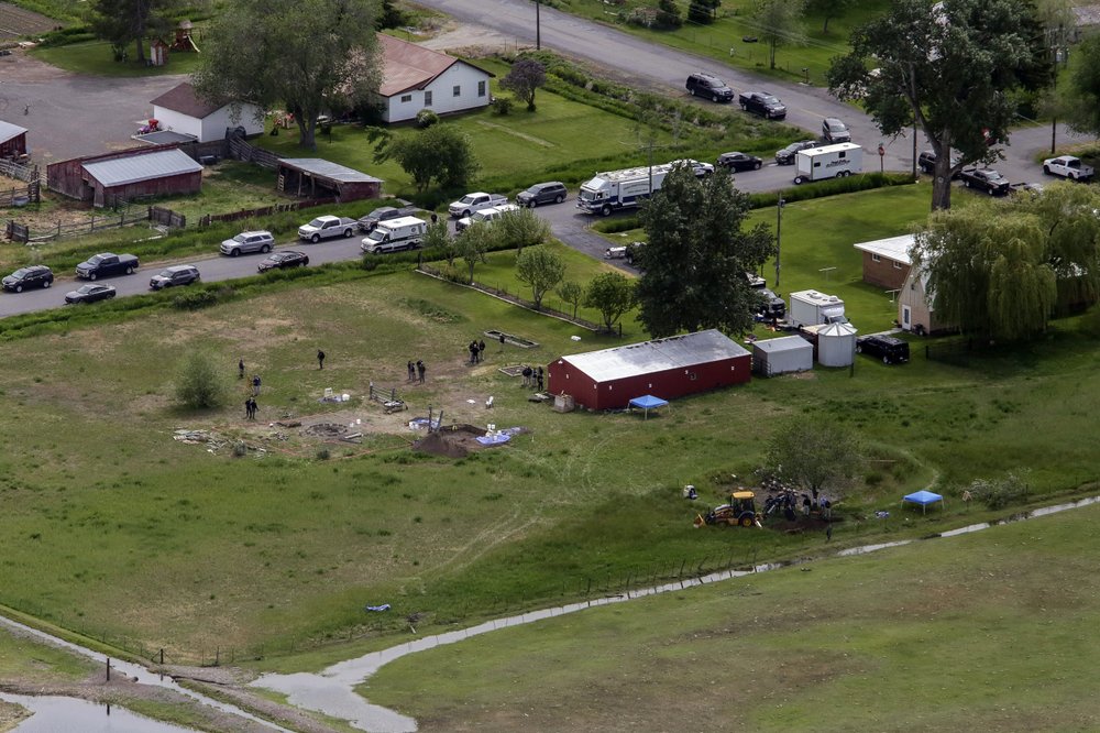 In this aerial photo, investigators search for human remains at Chad Daybell’s residence in the 200 block of 1900 East, Tuesday, June 9, 2020, in Salem, Idaho. Authorities say they uncovered human remains at Daybell’s home as they investigated the disappearance of his new wife’s two children.
