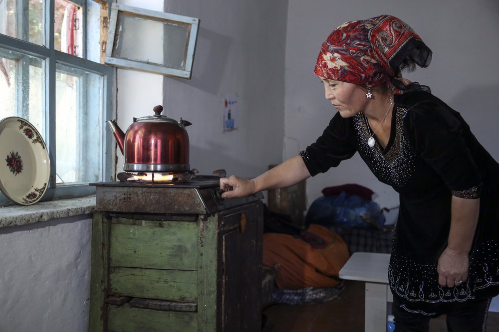 Gulnar Omirzakh prepares a kettle of tea in her home in Shonzhy, Kazakhstan on Saturday, June 13, 2020. “God bequeaths children on you. To prevent people from having children is wrong,” says Omirzakh of the Chinese government. “They want to destroy us as a people.
