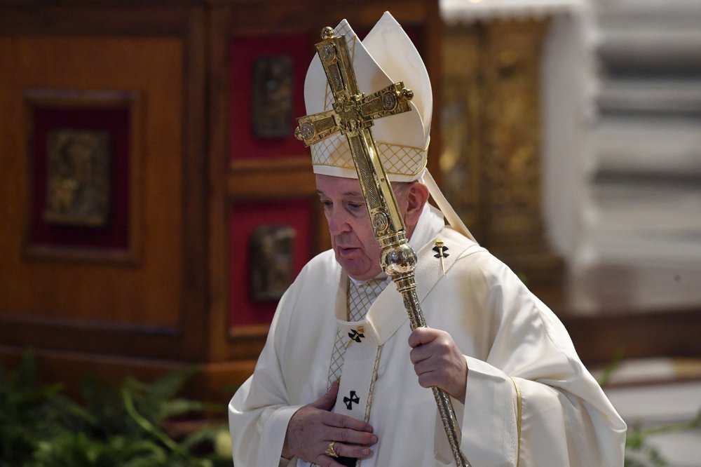 Pope Francis leaves after celebrating a Corpus Domini Mass, inside St. Peter's Basilica at the Vatican Sunday, June 14, 2020.