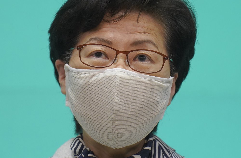 Hong Kong Chief Executive Carrie Lam listens to reporters' questions during a press conference in Hong Kong, Tuesday, June 16, 2020. Lam said she hoped that the opposition would not “demonize and stigmatize” the national security law as doing do would mean pitting themselves against the people of Hong Kong.