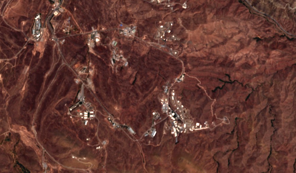 This June 21, 2020 photo from the European Commission's Sentinel-2 satellite shows a site before an explosion June 26, 2020, that rattled Iran’s capital. Analysts say the blast came from an area in Tehran’s eastern mountains that hides a underground tunnel system and missile production sites. 