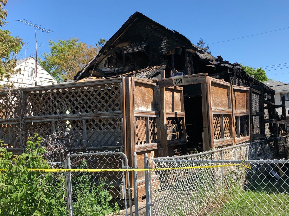 Tape now surrounds a charred home that went up in flames on Saturday morning.