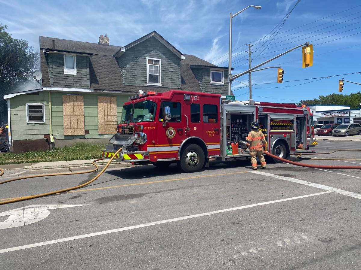 Fire crews respond to the scene of a fire at an abandoned multi-unit property at Adelaide and Nelson streets in London, Ont., June 8, 2020.