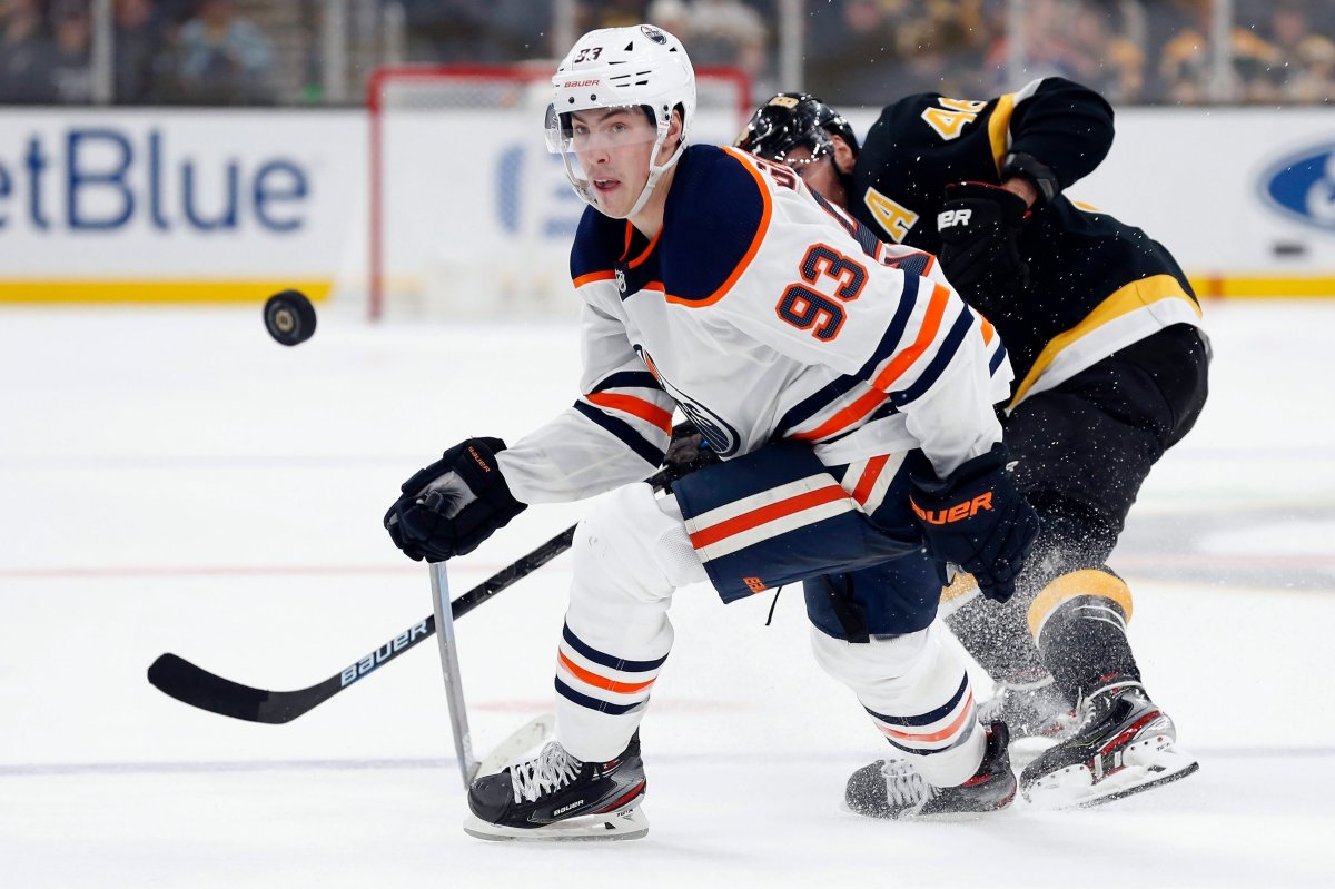 Edmonton Oilers' Ryan Nugent-Hopkins (93) defends against Boston Bruins' David Krejci (46) during the third period on an NHL hockey game in Boston, Saturday, Jan. 4, 2020. (AP Photo/Michael Dwyer).