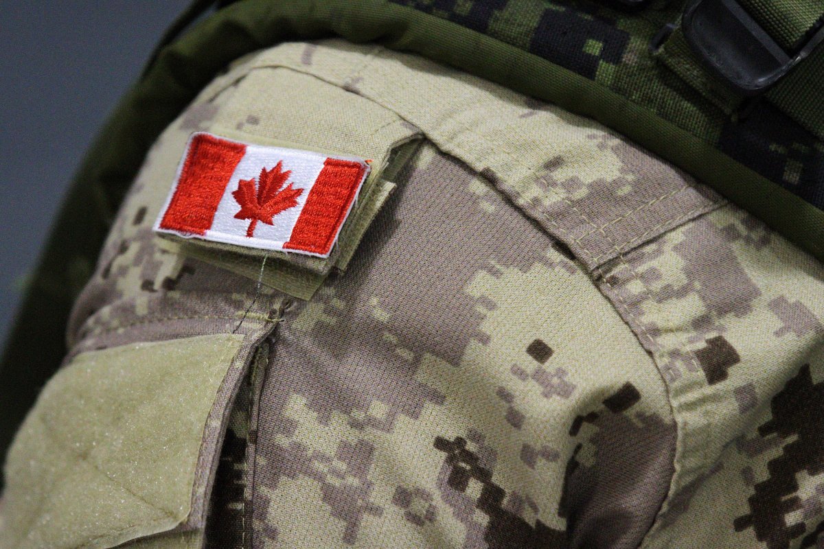 A Canadian flag patch is shown on the shoulder of a member of the Canadian forces in Trenton, Ont., on Thursday, Oct. 16, 2014. 