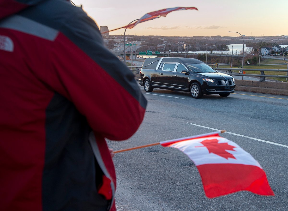 The hearse carrying Sub-Lt. Abbigail Cowbrough, one of the victims of a military helicopter crash, heads through Dartmouth, N.S. on Monday, May 11, 2020.