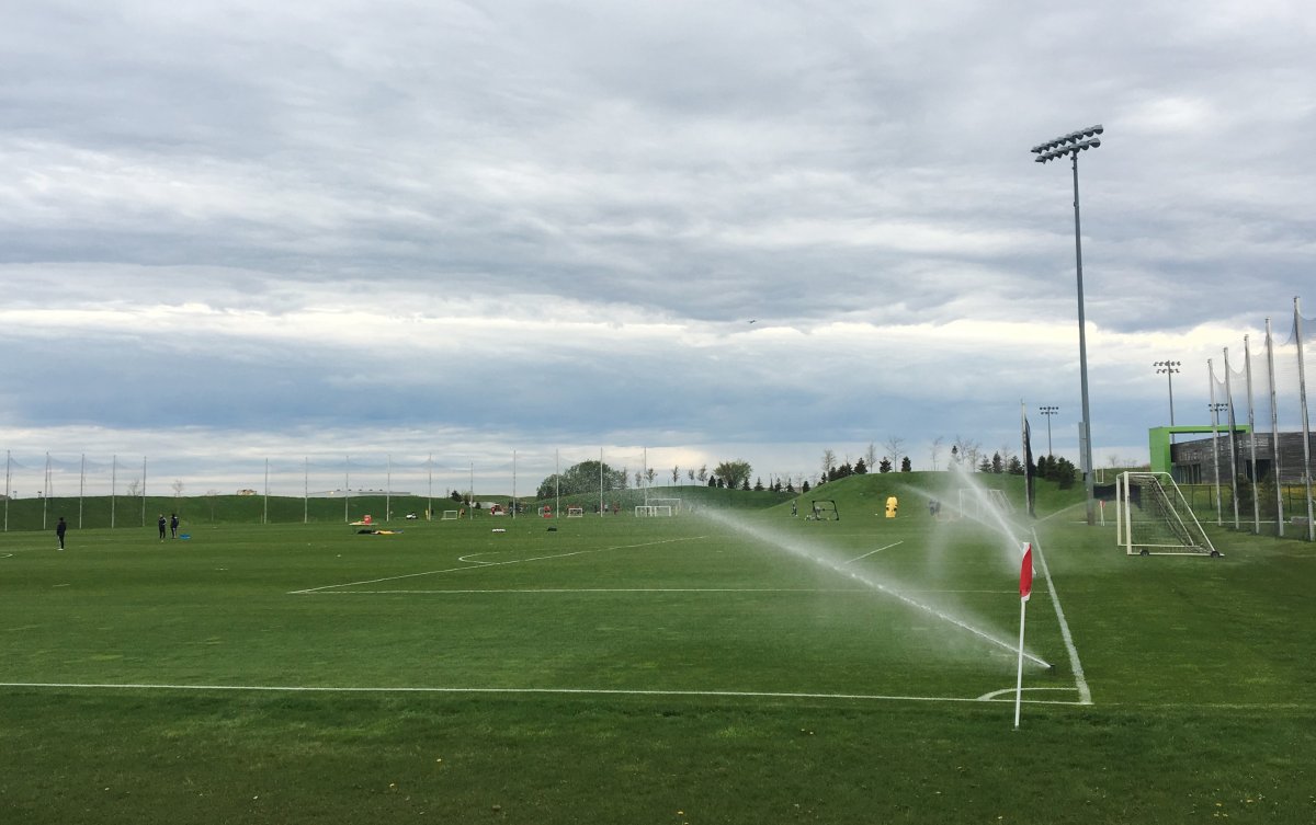 Sprinklers water Toronto FC's training grounds in Toronto in this photo from May 22, 2019. Toronto FC plans to up its training on Monday, going from individual workouts to small group sessions.