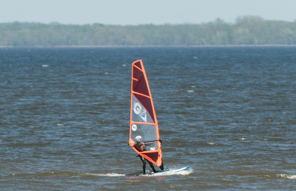 FILE: A person is shown windsurfing on the Lake of Two Mountains west of Montreal, Saturday, May 23, 2020.