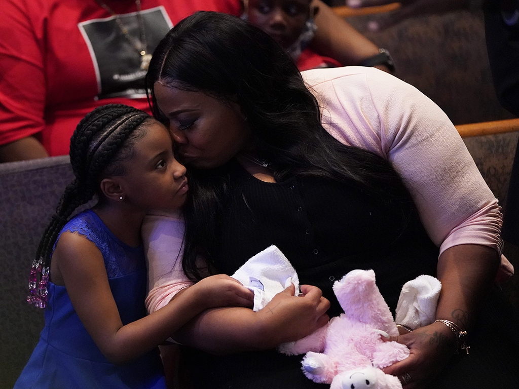 Roxie Washington holds Gianna Floyd, the daughter of George Floyd, as they attend the funeral service for George Floyd at the Fountain of Praise church, Houston, Texas, on June 9, 2020.