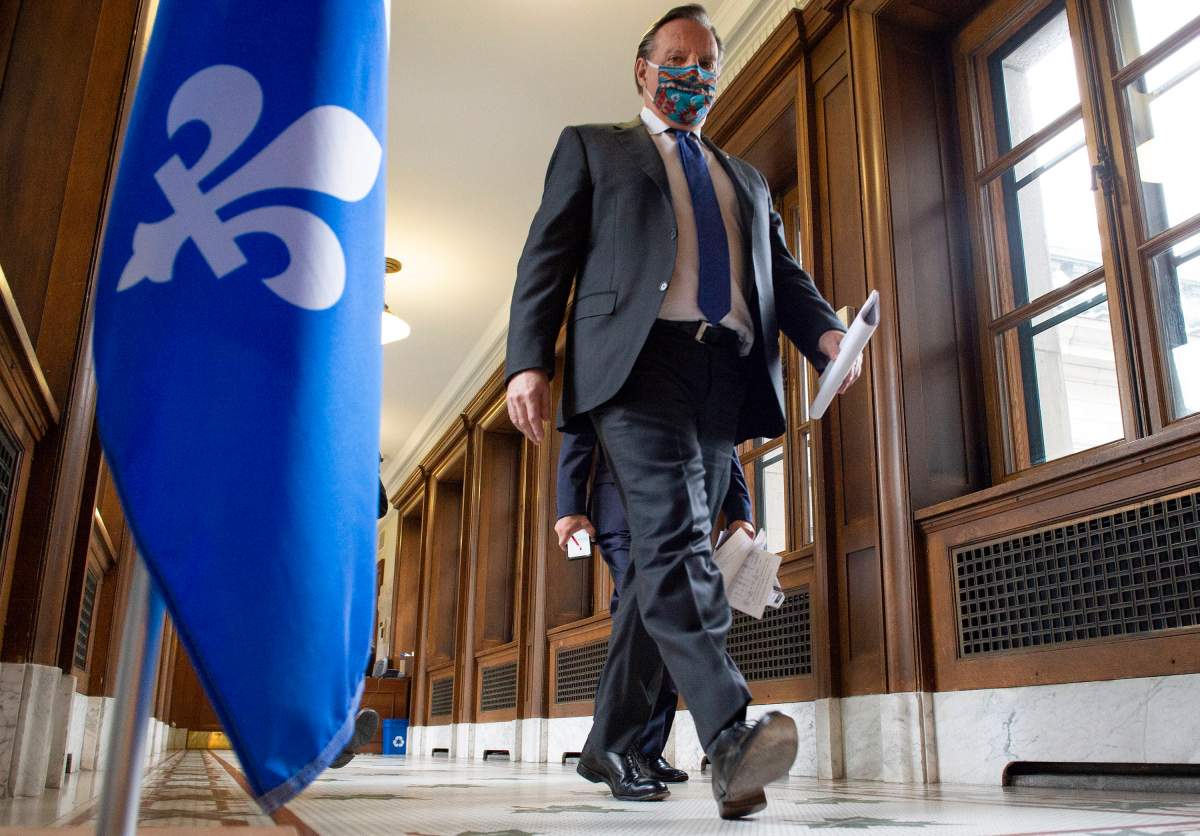 Quebec Premier Francois Legault walks to a news conference on the COVID-19 pandemic, Thursday, June 11, 2020 at the legislature in Quebec City. 