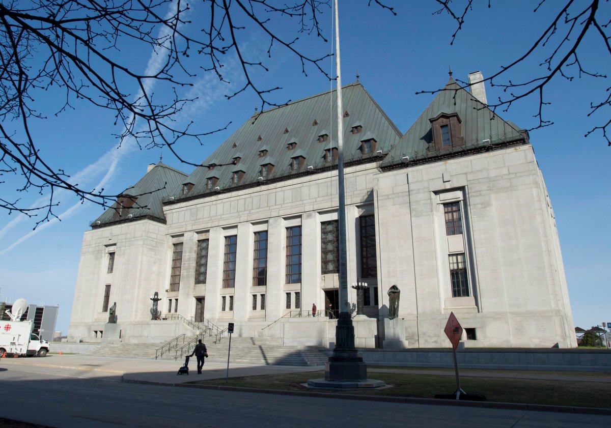 The Supreme Court of Canada is seen Friday April 25, 2014 in Ottawa. The Supreme of Court of Canada has sided with a man who was convicted of failing to comply with police checks while out on bail. 