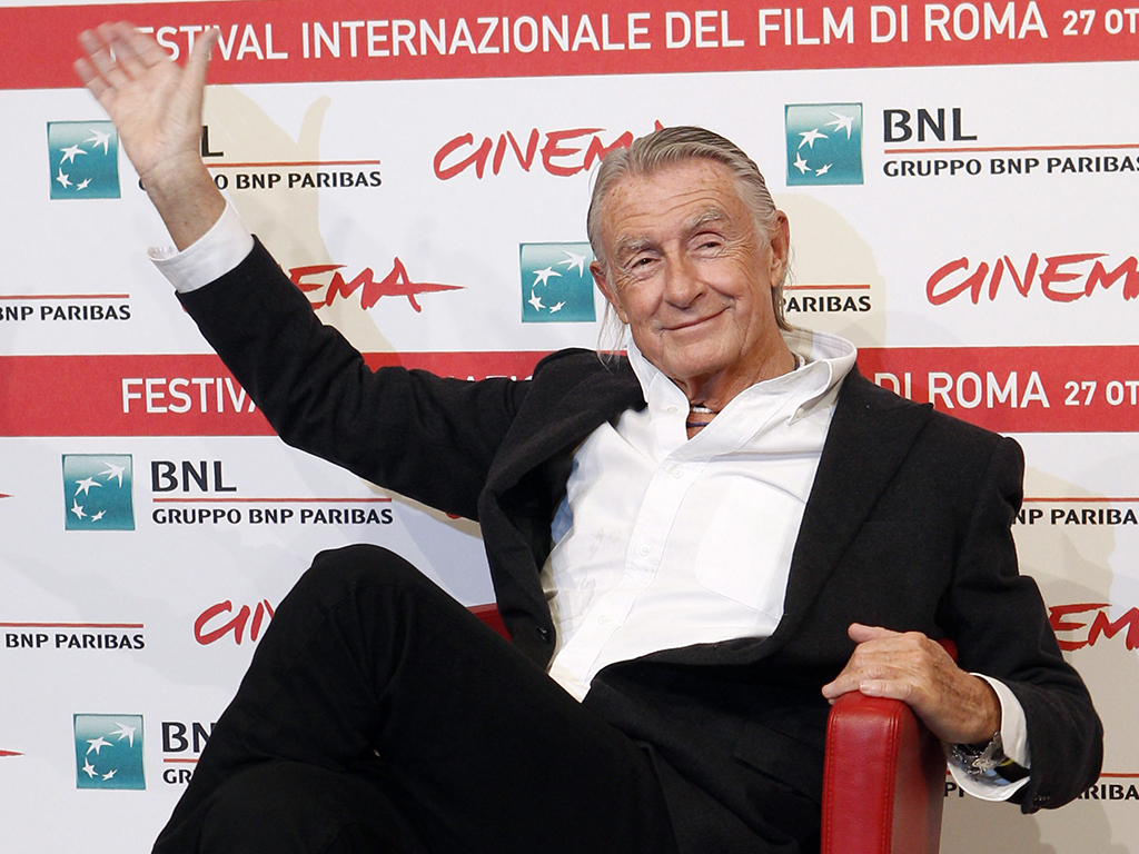 In this Nov. 3, 2011 file photo, director Joel Schumacher waves during a photocall for ‘Cinema and Advertising: Joel Schumacher directs Campari,’ at the Rome International Film Festival.