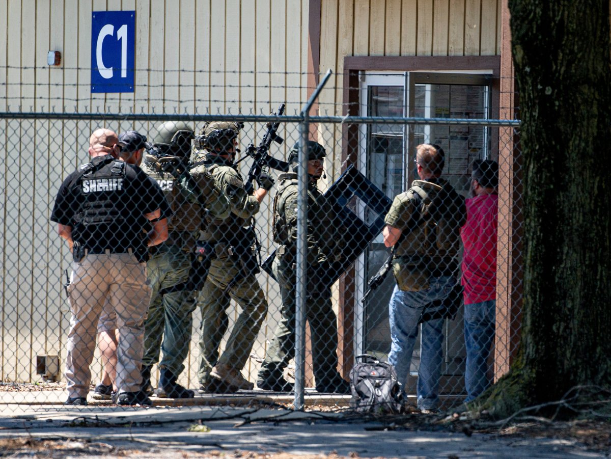 Law enforcement enter the C1 building to the west of the Bunn-O-Matic warehouse during an active shooter situation, Friday, June 26, 2020, in Springfield, Ill. 