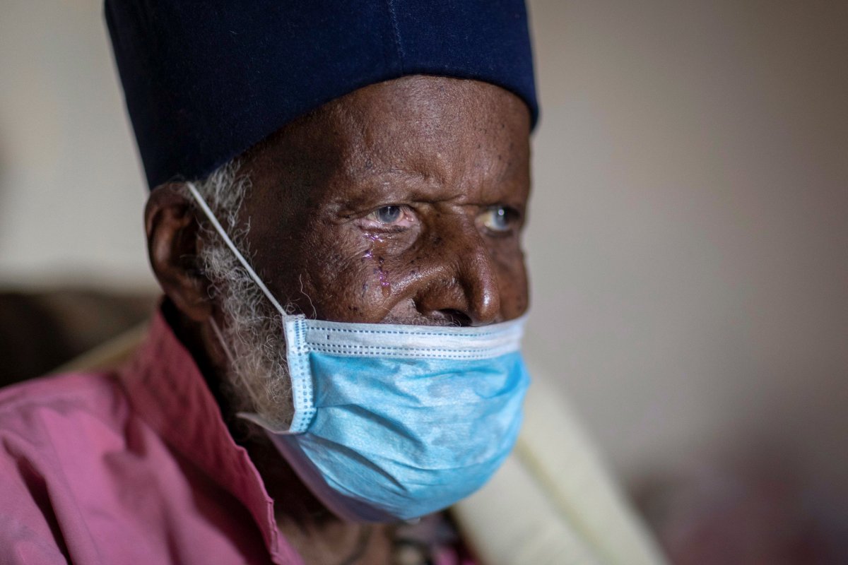 Centenarian Tilahun Woldemichael cries as he prays to God after spending weeks in hospital recovering from the coronavirus, at his house in Addis Ababa, Ethiopia June 27, 2020.