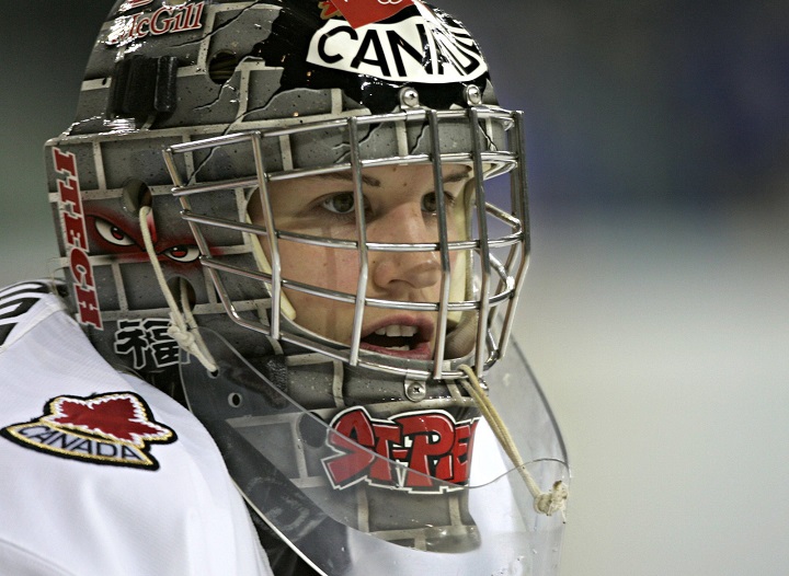 Canada's goalie Kim St-Pierre looks on during a 2006 Winter Olympics women's ice hockey match against Sweden, Tuesday, Feb. 14, 2006, in Turin, Italy. St-Pierre is the first female goalie to be inducted into the Hockey Hall of Fame. Thursday, June 25, 2020.