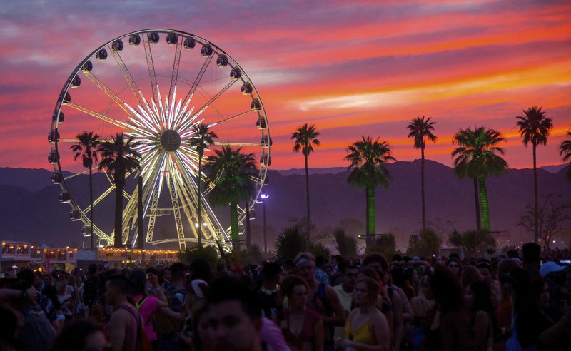 FILE - In this April 21, 2018 file photo, the sun sets over the Coachella Music & Arts Festival in Indio, Calif. The Coachella and Stagecoach music festivals have been canceled for 2020 due to coronavirus concerns. Riverside County's public health officer signed an order Wednesday, June 10, 2020, to cancel the popular festivals this year outside Palm Springs, Calif. 