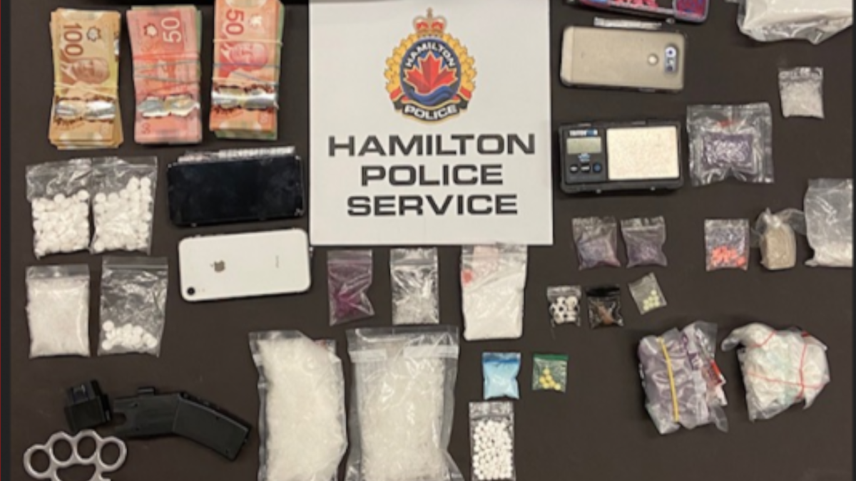 Hamilton police say an investigation into an alleged drug-trafficking operation turned up more than $100,000 in drugs, guns and cash.