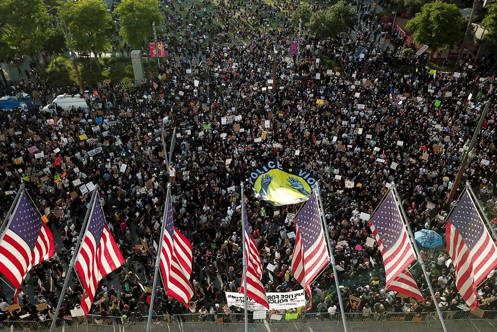 Demonstrators take part in a protest over the death of George Floyd who died May 25 after he was restrained by Minneapolis police, Wednesday, June 3, 2020, in downtown Los Angeles.