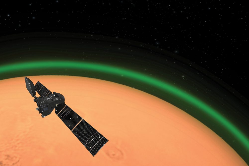 An artist’s impression of ESA’s ExoMars Trace Gas Orbiter detecting the green glow of oxygen in the Martian atmosphere.