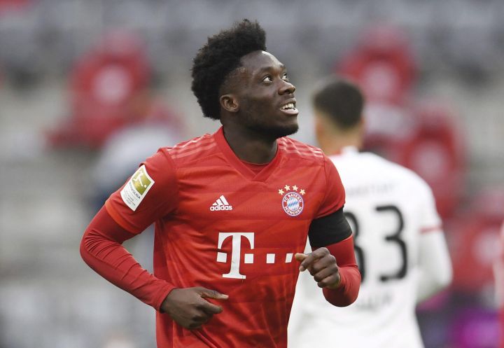 Bayern Munich’s Alphonso Davies celebrates scoring Munich’s fourth goal during the German Bundesliga soccer match between Bayern Munich and Eintracht Frankfurt in Munich, Germany, Saturday, May 23, 2020. Davies says his family’s trials have left their mark, but in a good way. The experiences taught the 19-year-old budding Bayern Munich star to make the best out of situations.