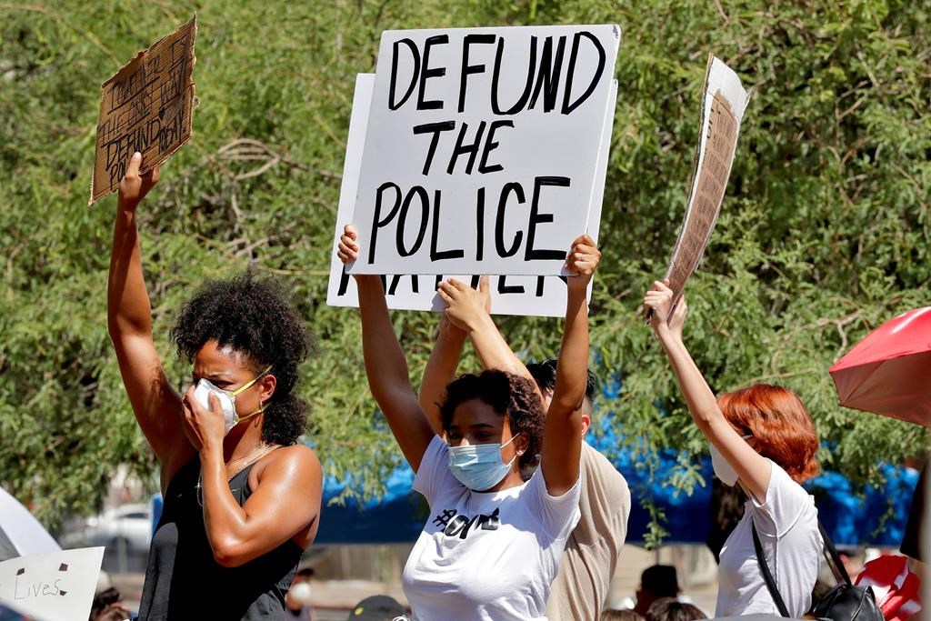 Protesters rally Wednesday, June 3, 2020, in Phoenix, Ariz., demanding the Phoenix city council defund the Phoenix Police Department.