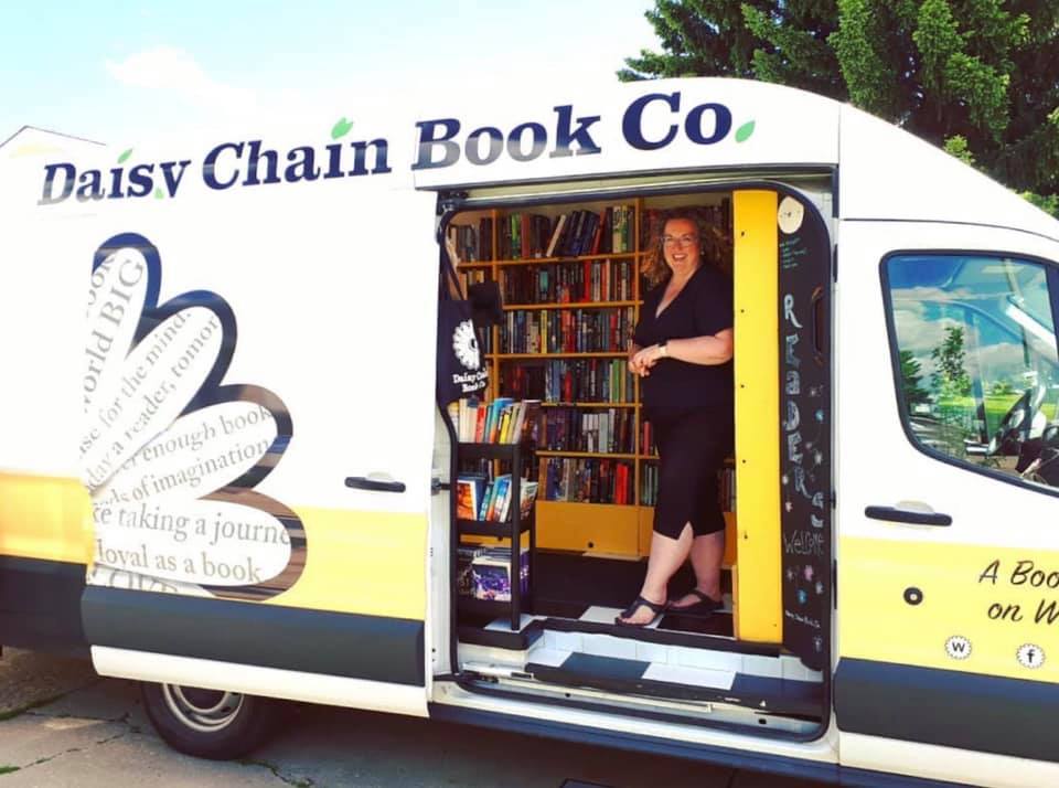 Owner Brandi Morpurgo in the Daisy Chain Book Co. book truck. 