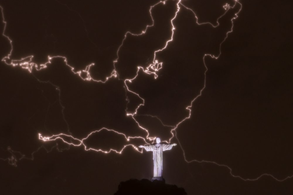 Lightning flashes over the statue of Christ the Redeemer on top of the Corcovado hill in Rio de Janeiro, Brazil, on Jan. 16, 2014.