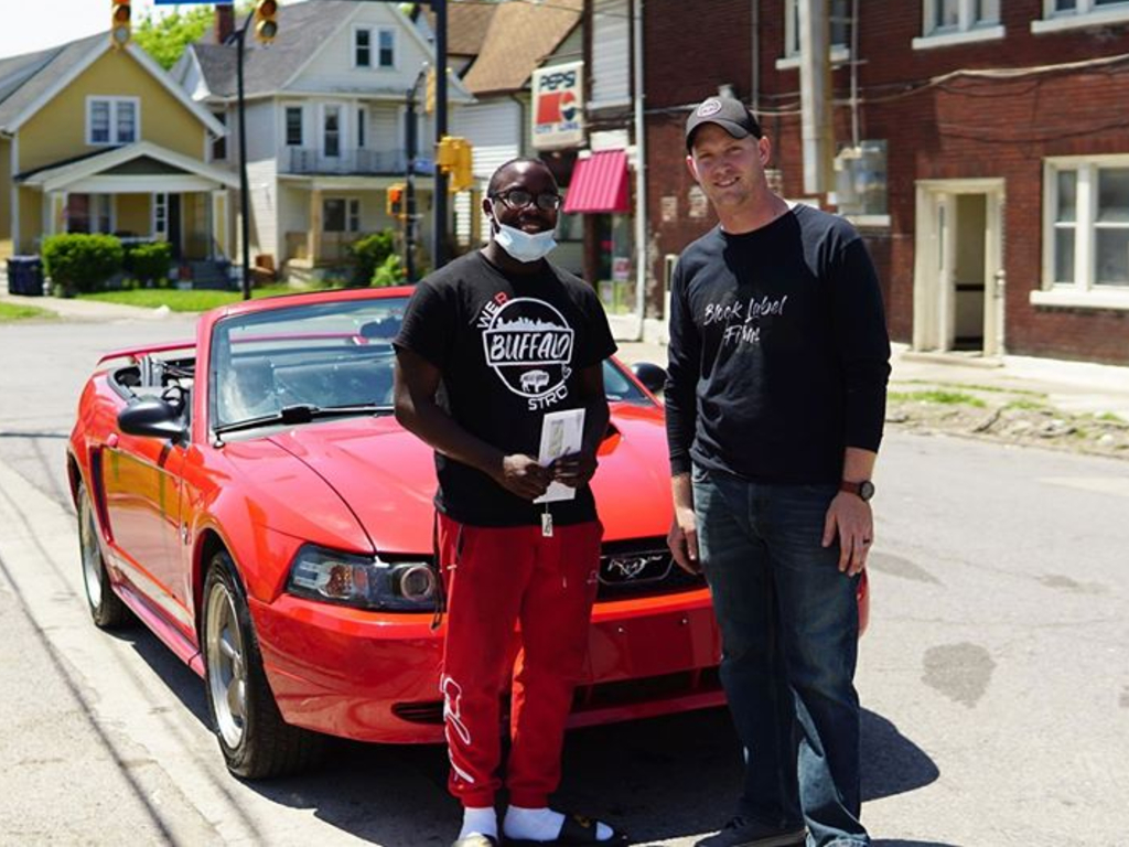 Antonio Gwynn Jr., 18, cleaned up the Buffalo streets following the protests. As a thank you, neighbour Matt Block gifted him his old red Mustang.