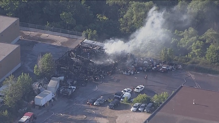 An aerial photo of the fire on Champagne Drive in Toronto.The lot broke out in flames again Friday.