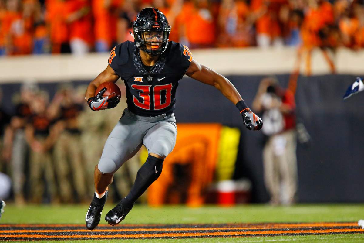 Running back Chuba Hubbard #30 of the Oklahoma State Cowboys looks for an opening against the South Alabama Jaguars in the second quarter on September 8, 2018 at Boone Pickens Stadium in Stillwater, Oklahoma.