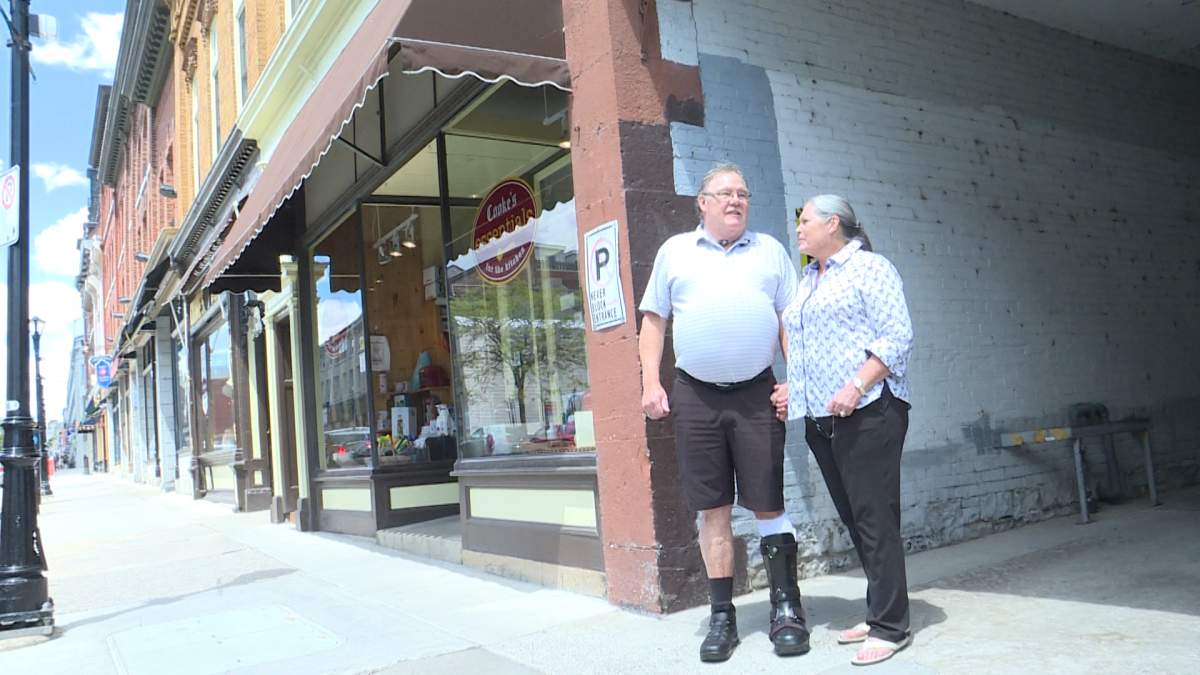 Terry Whyte and Susan Cooke stand near their driveway access laneway