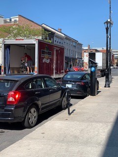 Delivery trucks in front Cooke’s Fine Foods on Friday.