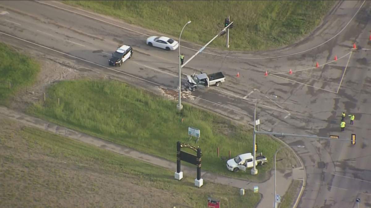 RCMP and Edmonton police on scene of a collision on 50 Street and Highway 510 in Beaumont, Alta., Thursday, June 11, 2020. 
