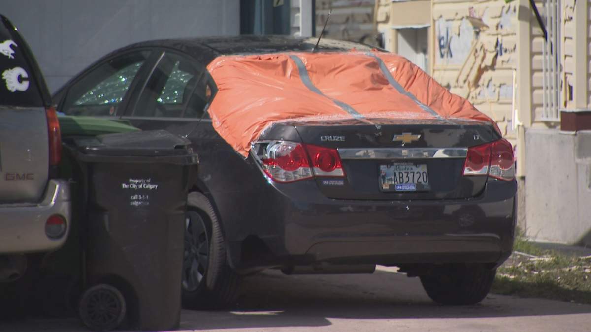 One of many cars damaged by violent storm