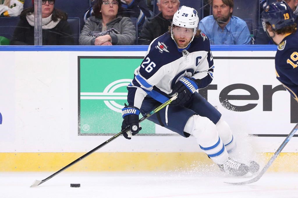 Winnipeg Jets forward Blake Wheeler (26) controls the puck during the second period of an NHL hockey game against the Buffalo Sabres, Sunday, Feb. 23, 2020, in Buffalo, N.Y.