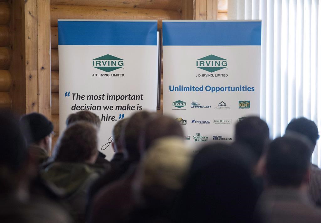J.D. Irving Ltd. signage is seen as hundreds of people attend a job fair in Sussex, N.B., on Thursday, January 28, 2016.