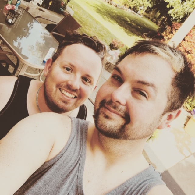 Winnipegger Jeremy Ernst (left) and his partner Michael Laducer are separated by the Canadian-U.S. border.