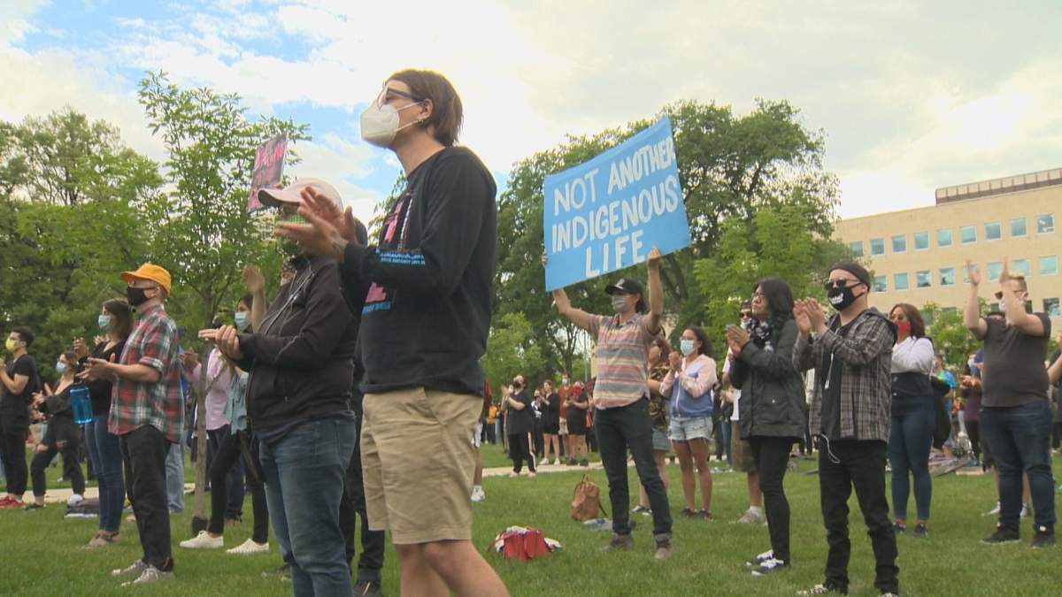 The crowd applauds at the Justice for Eishia rally Friday night.