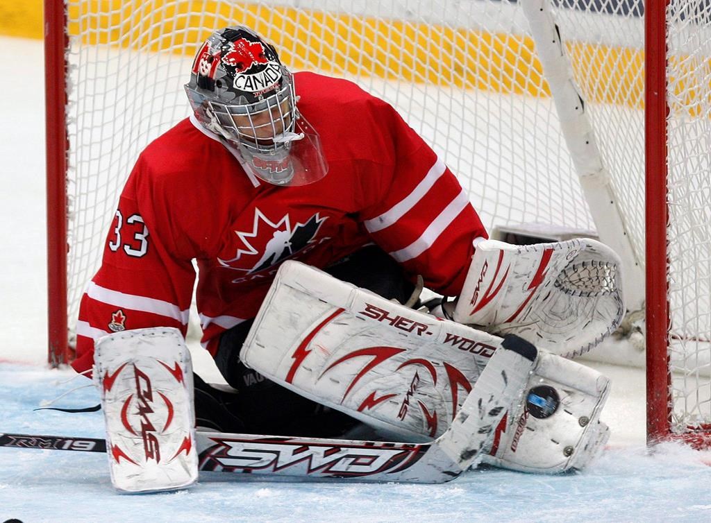 Team Canada goalkeeper Kim St. Pierre makes a save against Team Finland in a 8-0 shutout during third period action at the World Women Hockey Championship Wednesday, April 8, 2009 in Hameenlinna Finland.