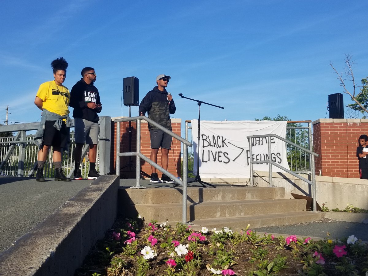 Kate Macdonald, DeRico Symonds and Trayvone Clayton, co-founders of Game Changers 902, challenge participants at an anti-racism rally to fight oppression proactively in their communities. The event took place in Spryfield, Halifax on Wed. June 17, 2020.