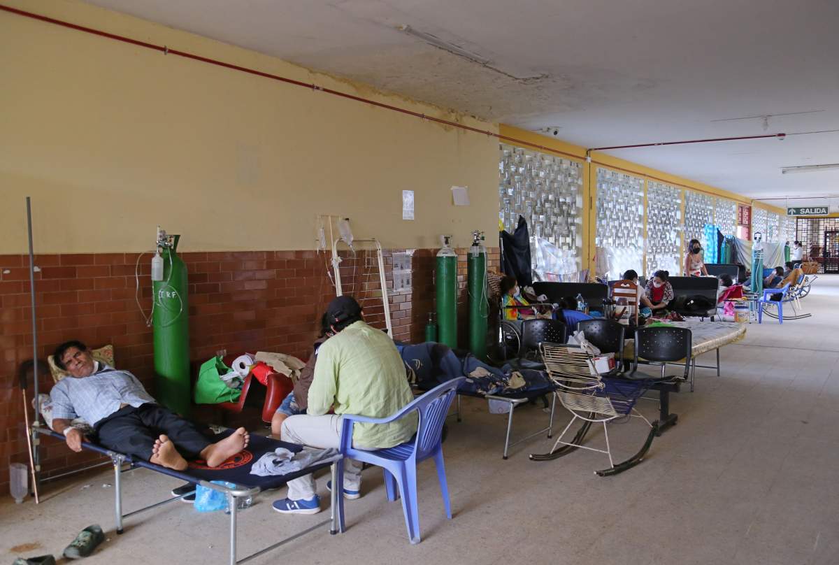 Patients with COVID-19 are assisted in a hallway of the regional hospital in Iquitos, the largest city in the Peruvian Amazon, Peru on May 14, 2020 during the novel coronavirus pandemic.