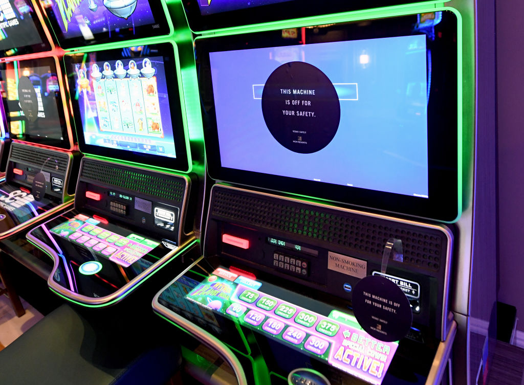Social distancing placards are placed on a slot machine that is out of service at Bellagio Resort & Casino on the Las Vegas Strip after the property opened for the first time since being closed on March 17 because of the coronavirus (COVID-19) pandemic on June 4 in Las Vegas, Nevada.