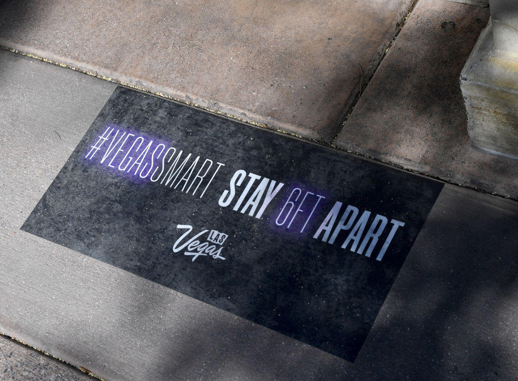 A social distancing decal is affixed to the sidewalk in front of Bellagio Resort & Casino on the Las Vegas Strip shortly before the property opened for the first time since being closed on March 17 because of the coronavirus (COVID-19) pandemic on June 4, 2020 in Las Vegas, Nevada. 