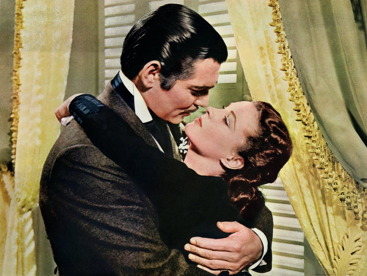 Rhett Butler (Clark Gable) embraces Scarlett O'Hara (Vivien Leigh) in a famous scene from the 1939 film 'Gone with the Wind.'.