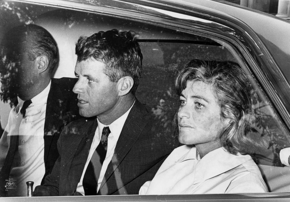 Bob Kennedy, left, and Jean Kennedy Smith, right, leave the hospital for a brief ride after spending all night with their injured brother Senator Ted Kennedy in Boston, 1964.