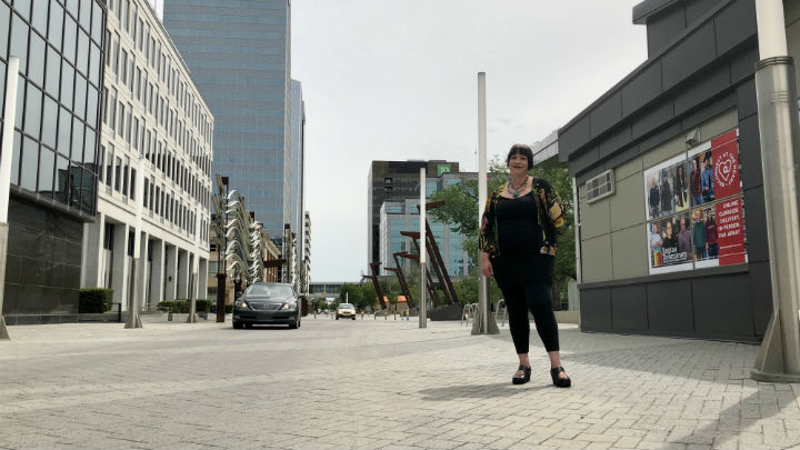 Regina Farmers’ Market executive director Holly Laird stands where the designated entrance and exit will be located, at the corner of Lorne Street and 12 Avenue, for public health safety.