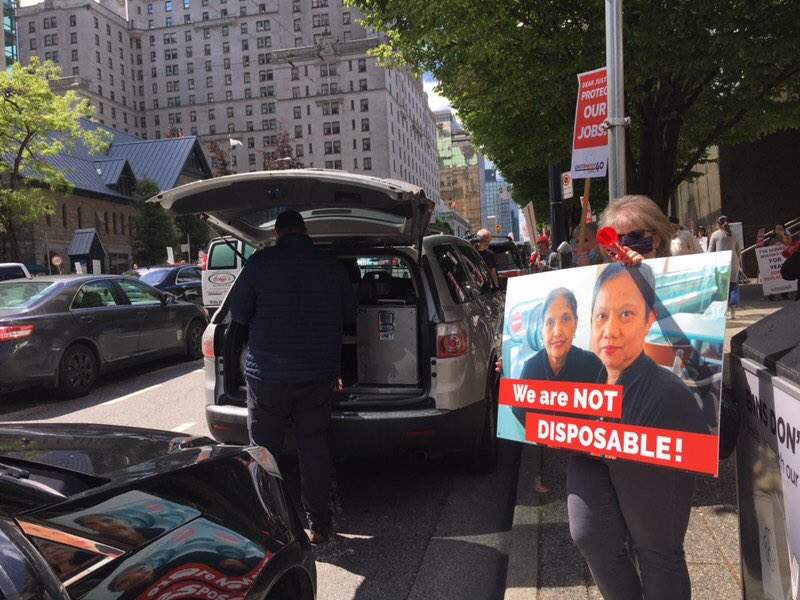 People held signs and encouraged drivers passing by to honk in support.