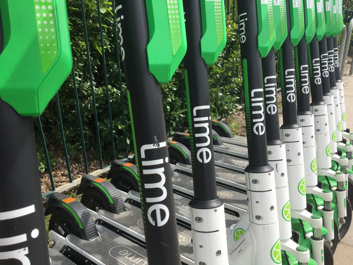 File photo of a row of Lime electric scooters.